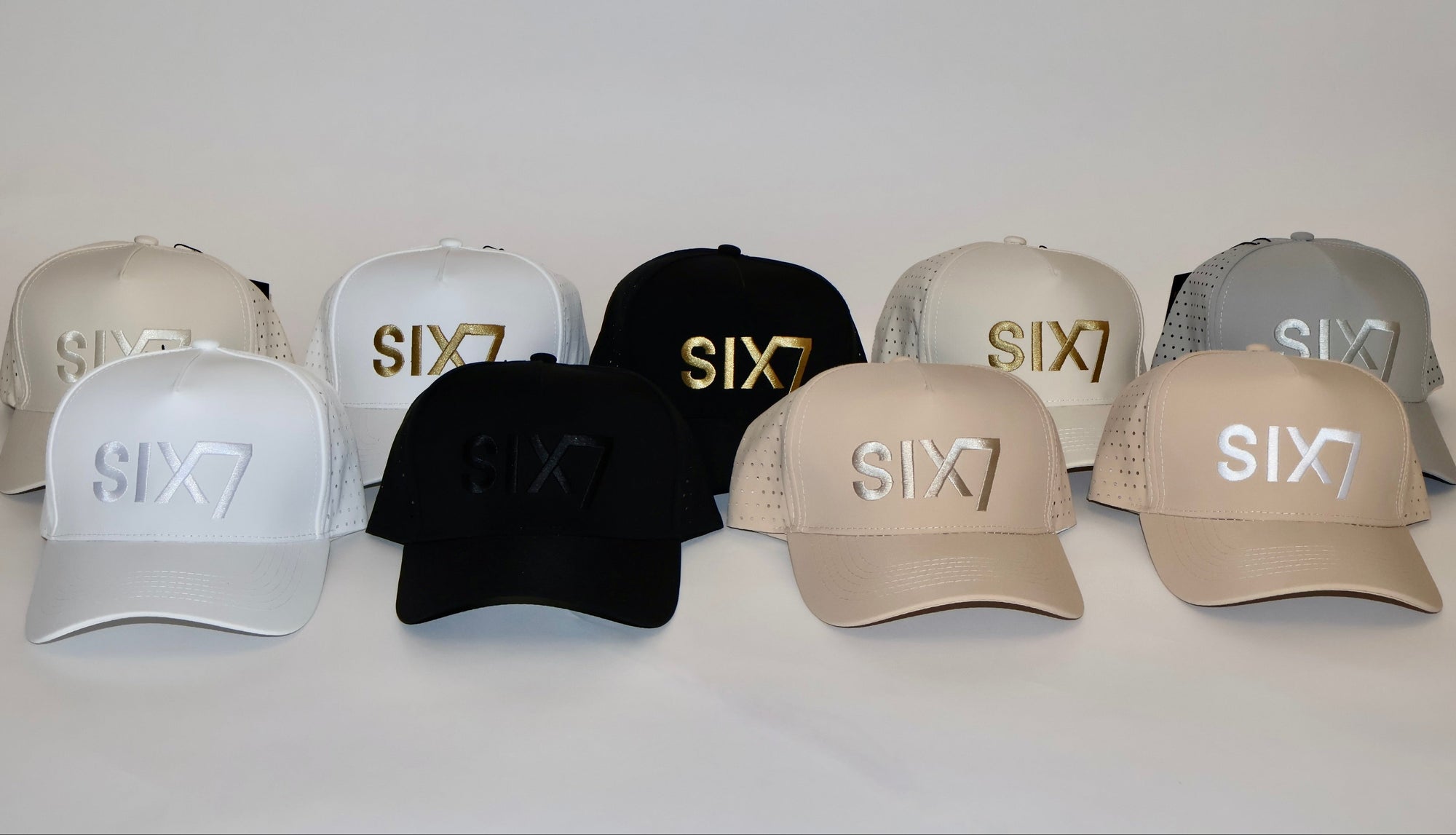 Six Seven premium performance 5-panel snapback hats in black, white, beige, and tonal colorways. Luxury water -resistance hats designed for high-performance lifestyle, mindset, and legacy